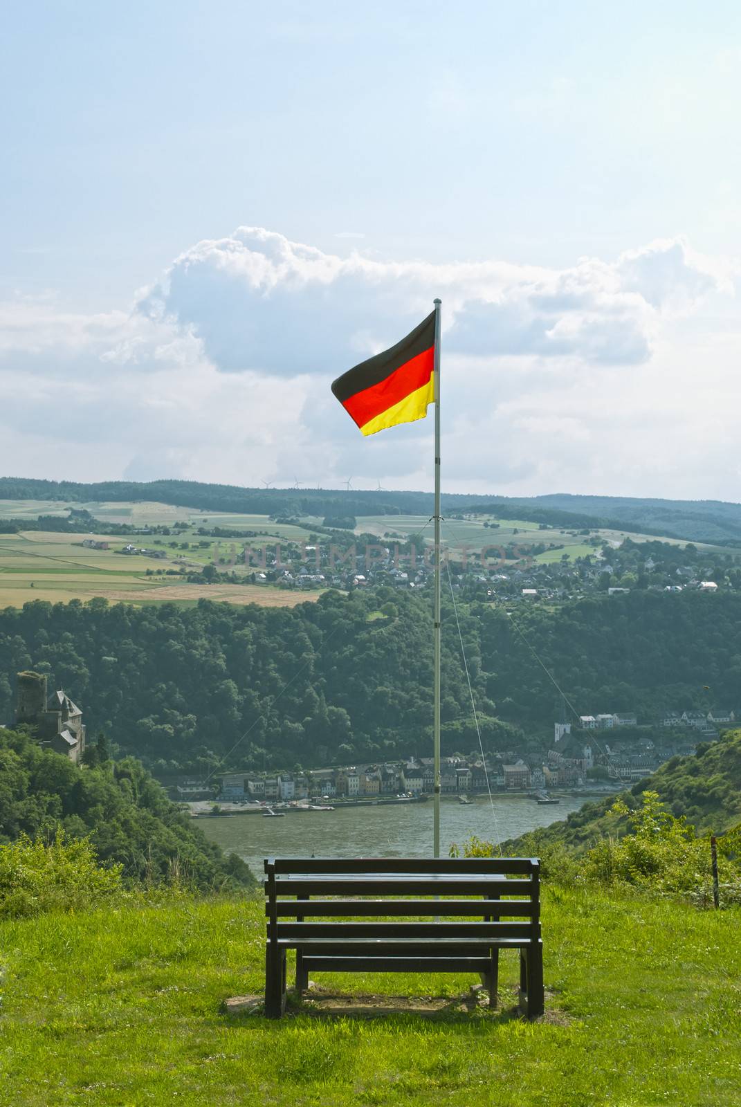 Beautiful summer landscapeand, view on the river Rhein and German flag above the German town of St. Goarshausen in Rhineland-Palatinate