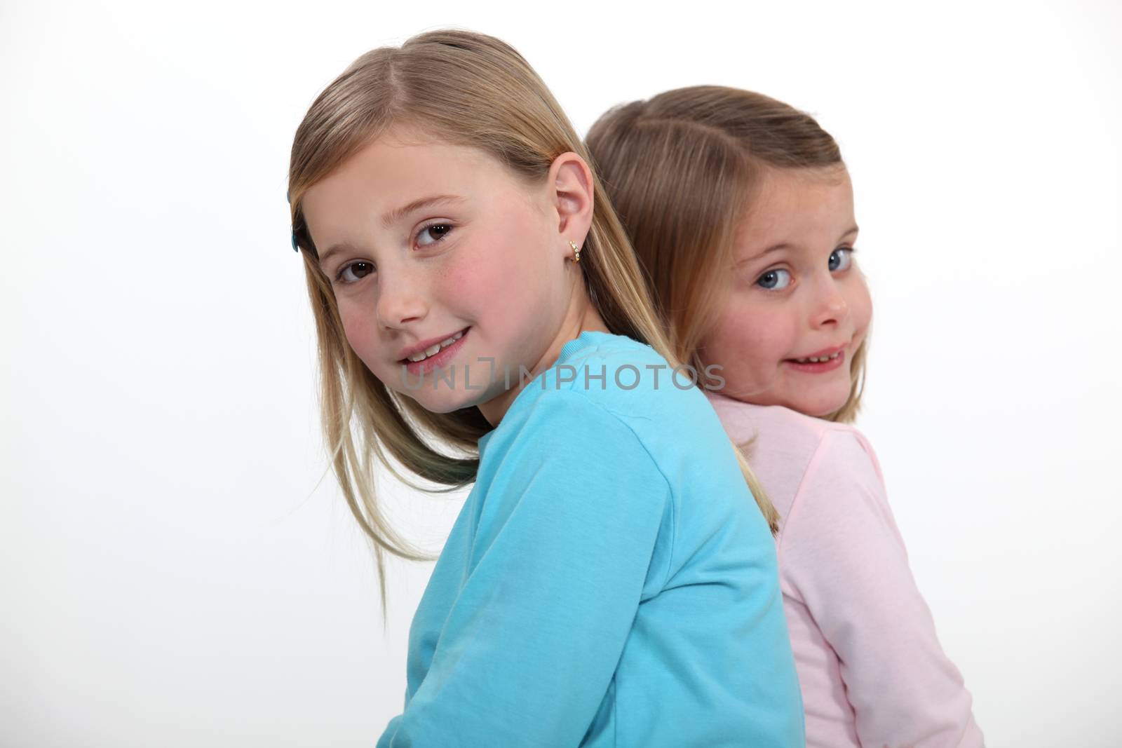 two little girls posing together