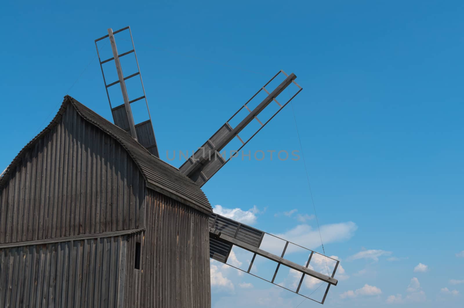 Old wooden windmill rear view.