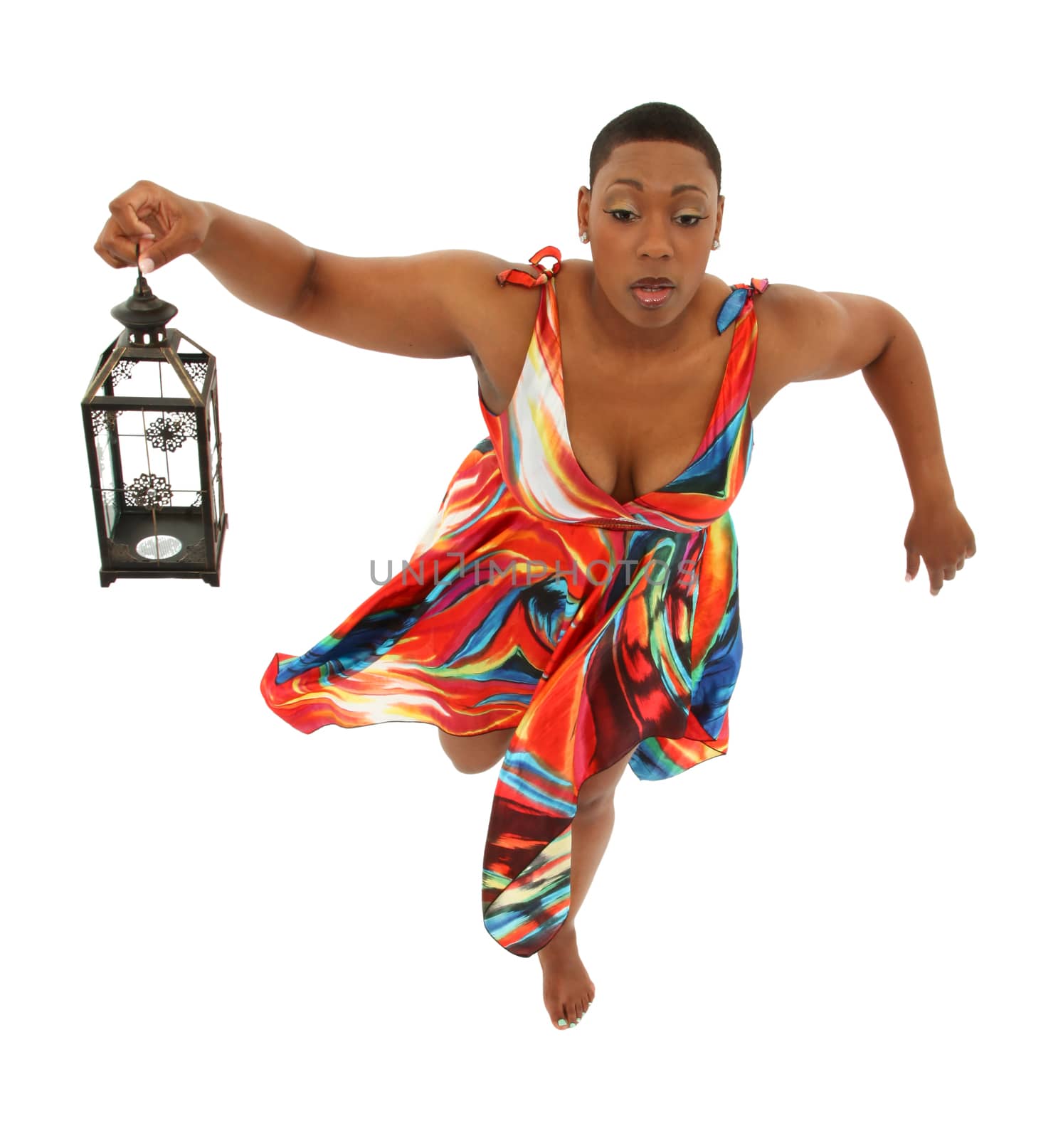 Beautiful Black Woman in Colorful Dress Floating over white background. Holding lantern.