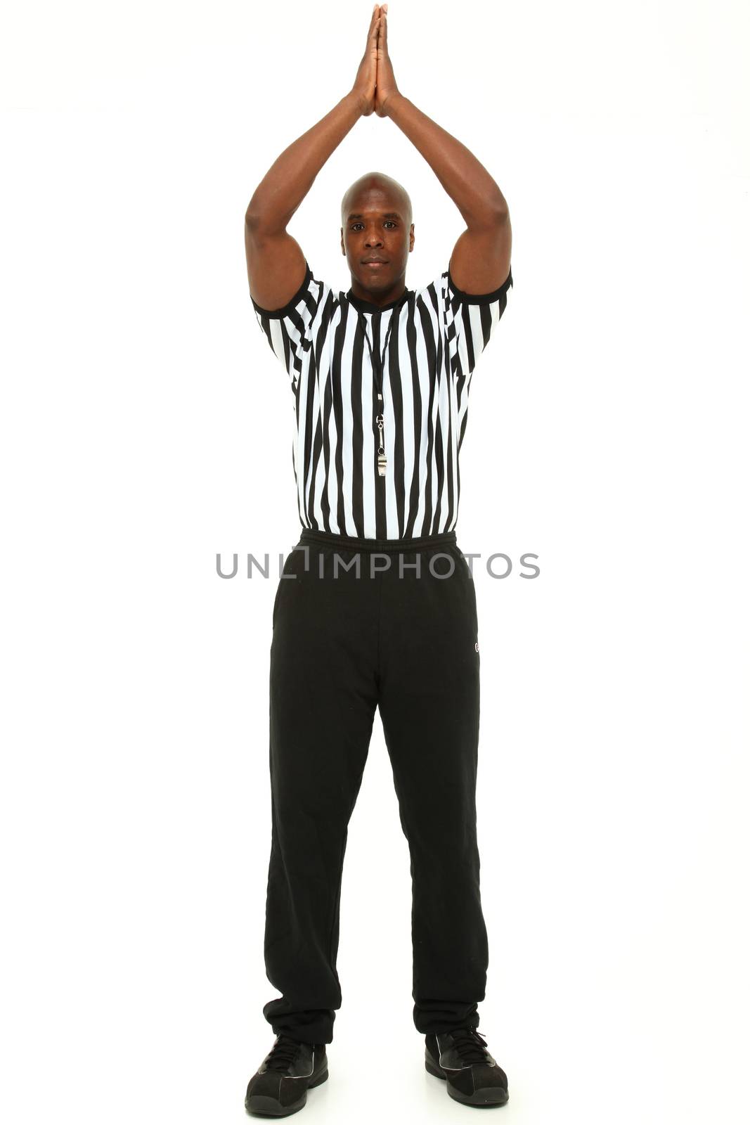 Attractive fit black man in referee uniform over white. by duplass