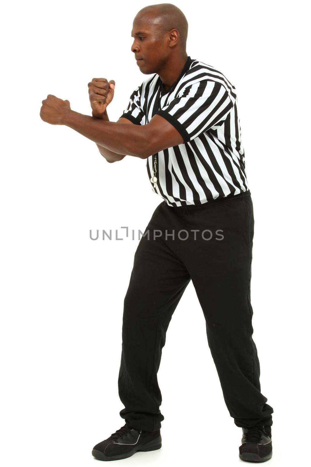 Attractive fit black man in referee uniform over white. by duplass