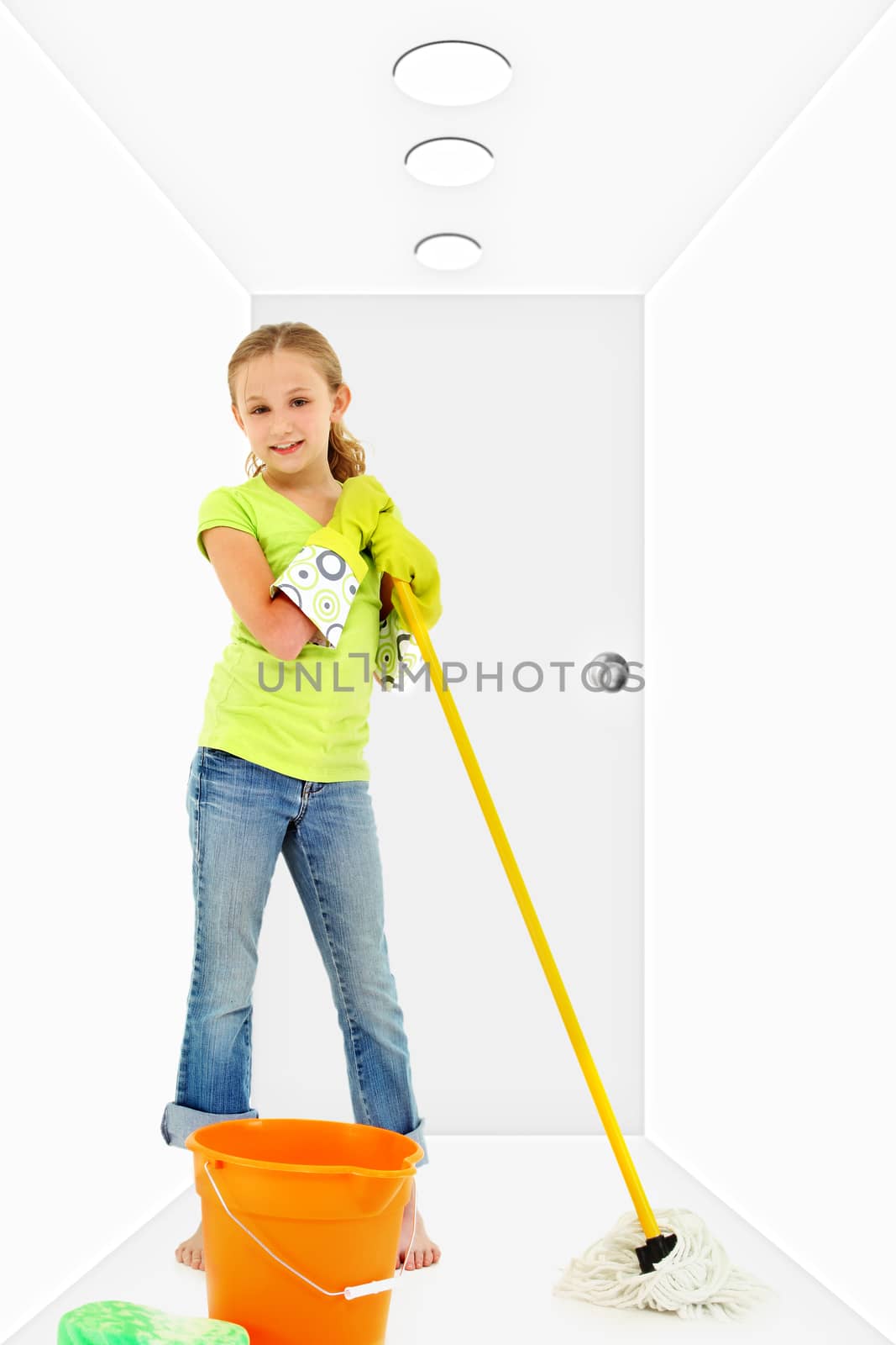 Child with mop bucket sponge in white hallway cleaning.