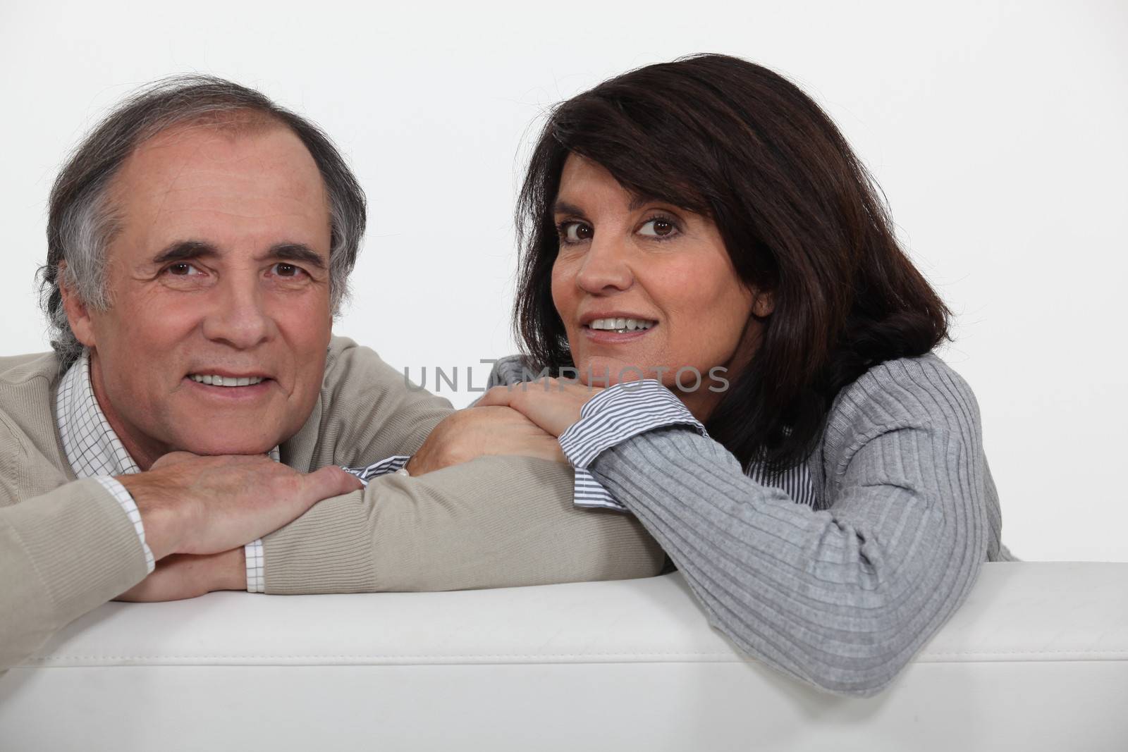 Couple on their sofa.