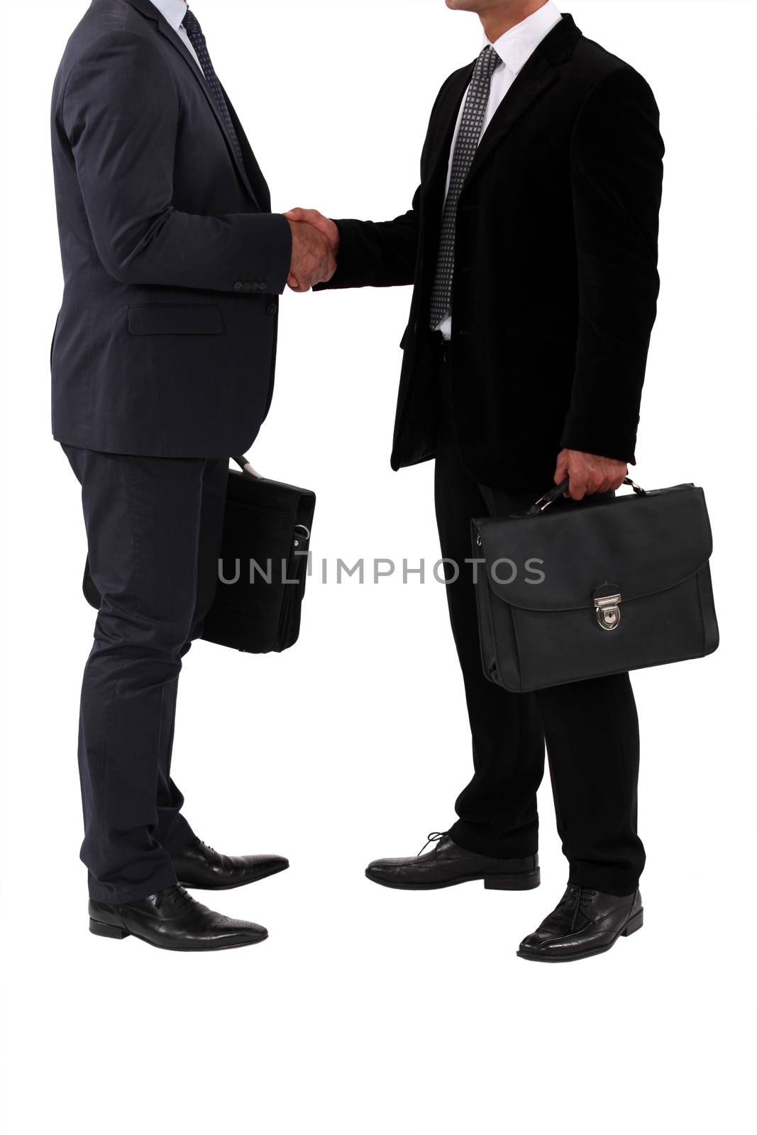businessmen shaking hands by phovoir