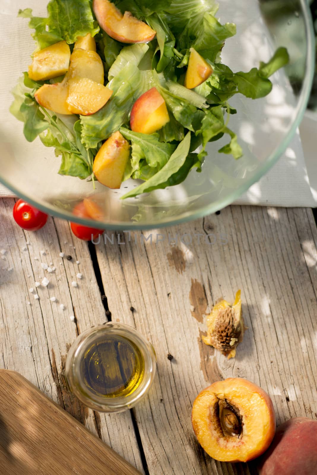 Salad preparation on a traditional wooden table outdoors