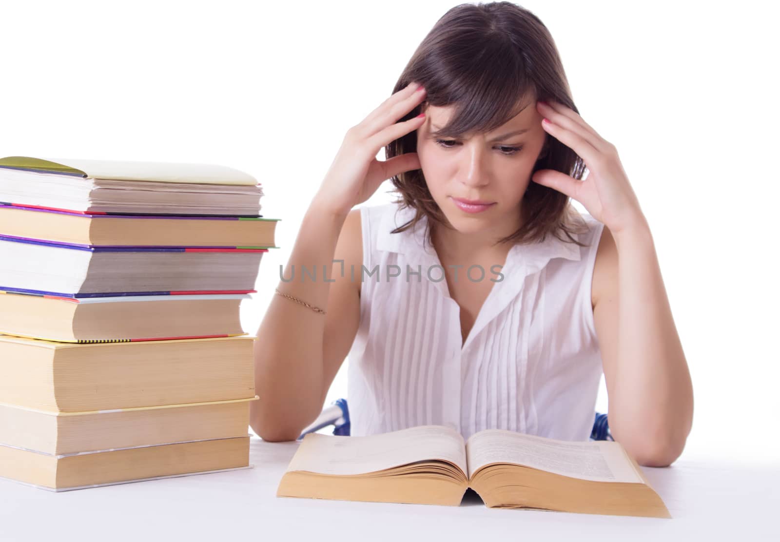 Concentrated student girl reading books isolated on white