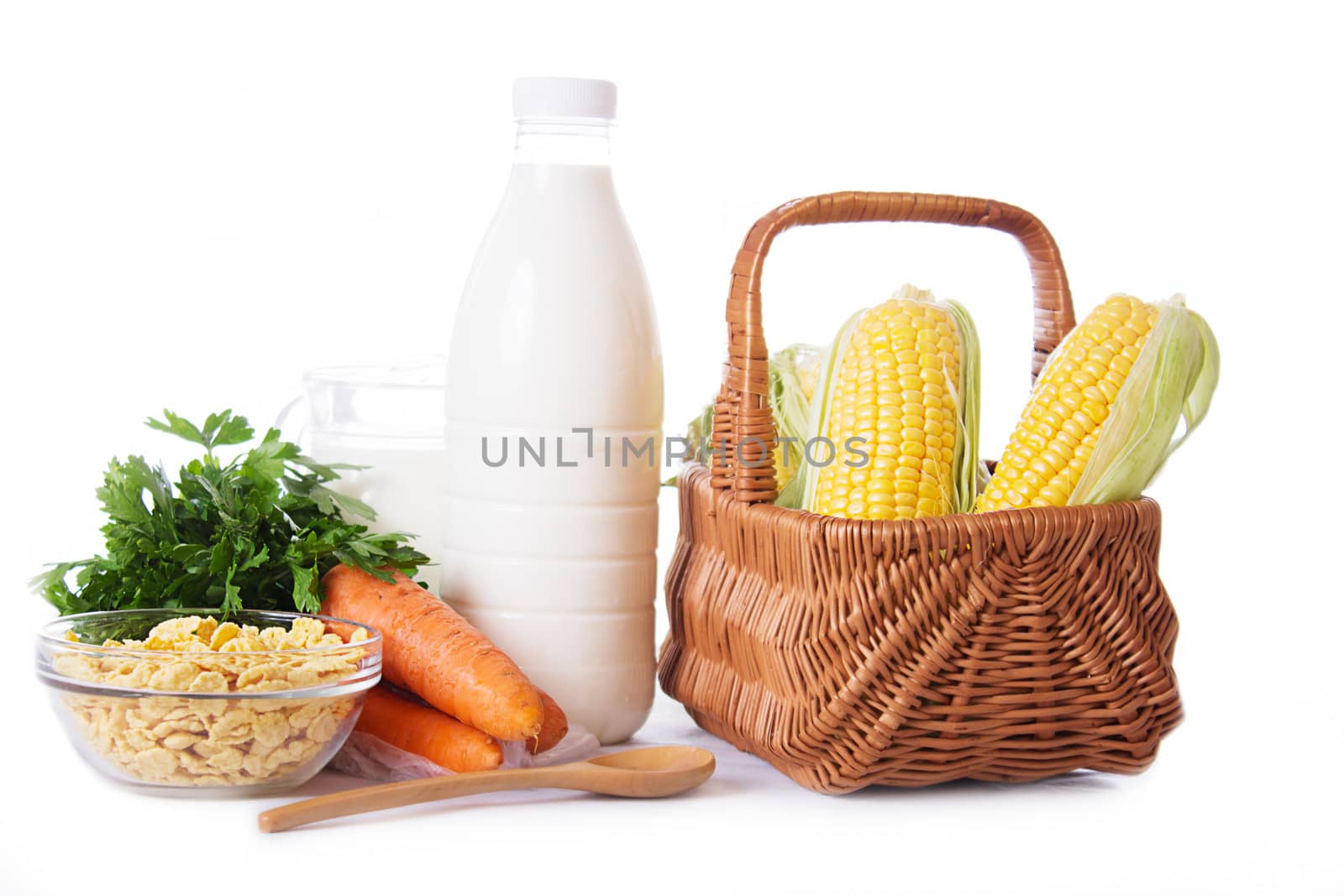 Milk, cereals and some vegetables isolated on white