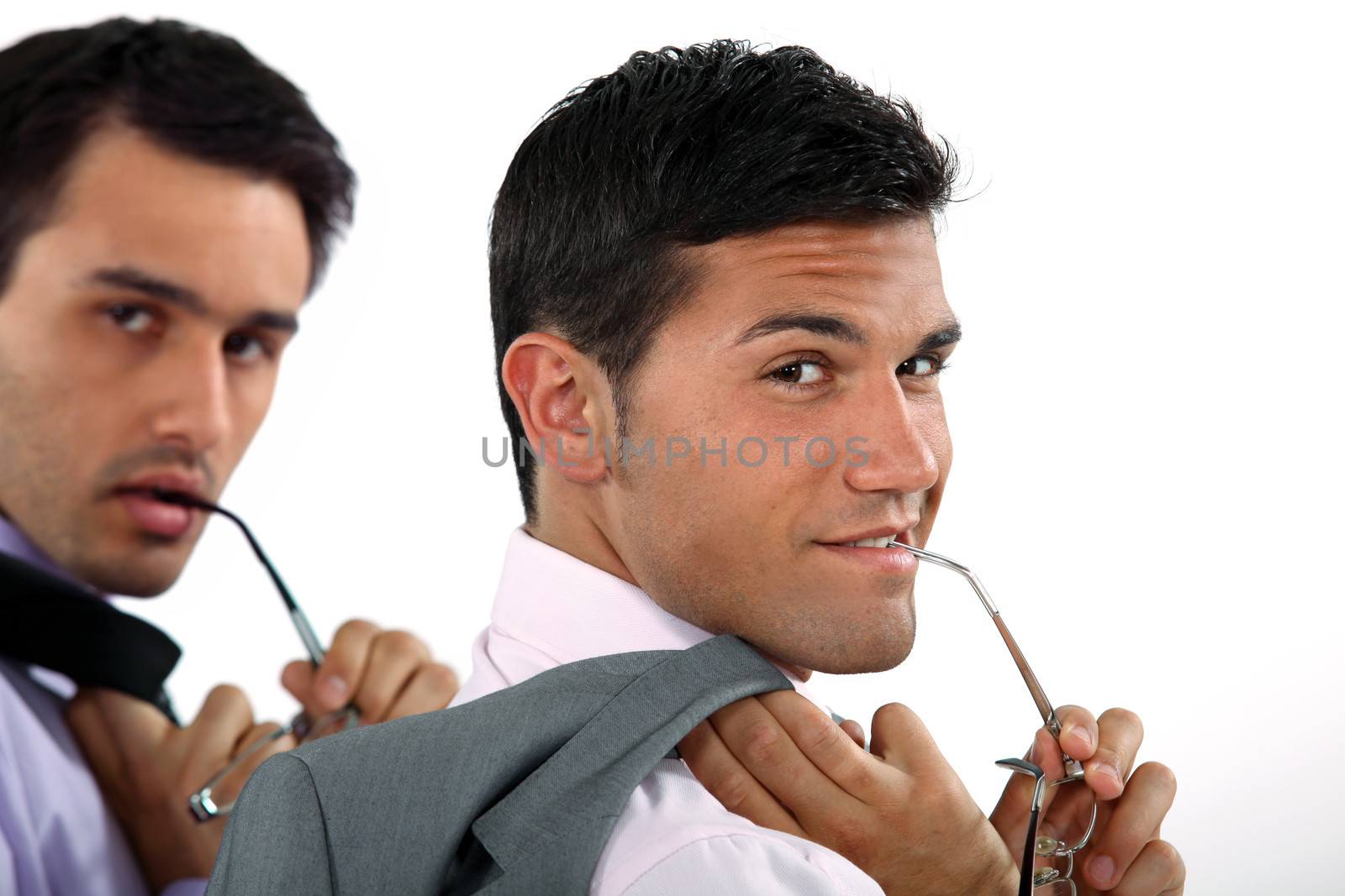 two sexy businessmen posing