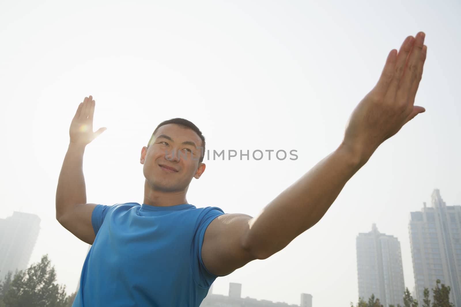 Young Muscular Man Stretching