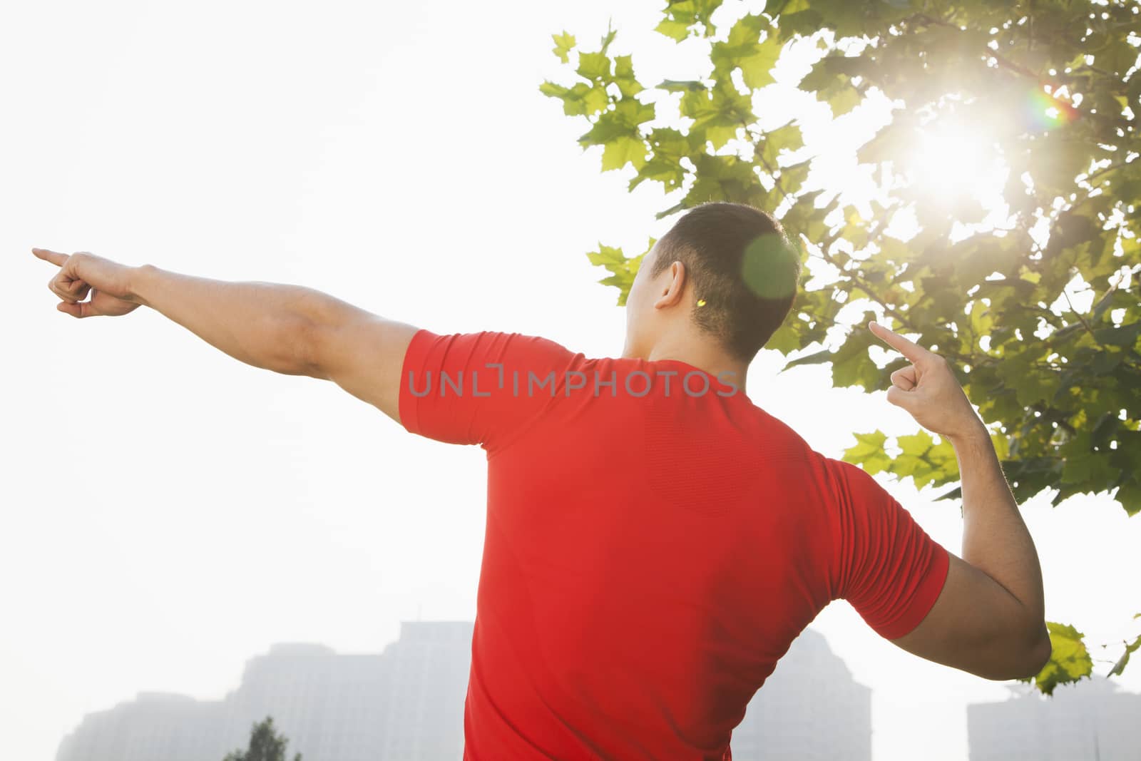 Young Muscular Man Stretching
