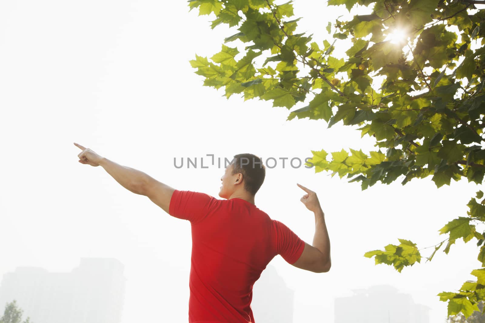 Young Muscular Man Stretching