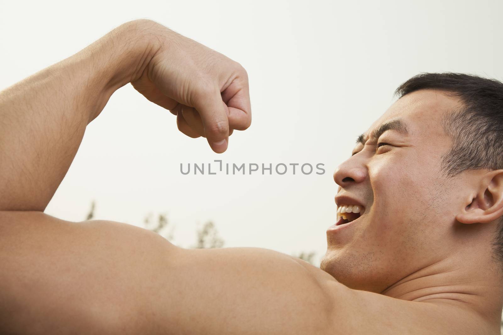 Man Flexing Muscles