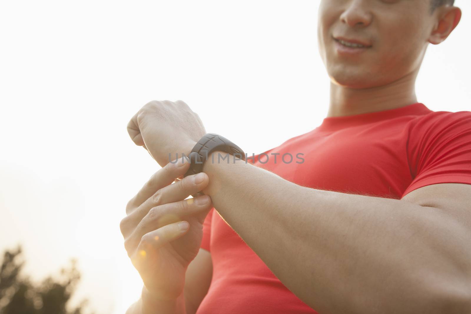 Muscular Man Checking His Watch