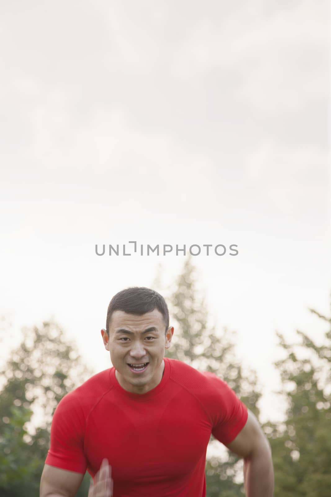 Muscular Man Running Toward Camera