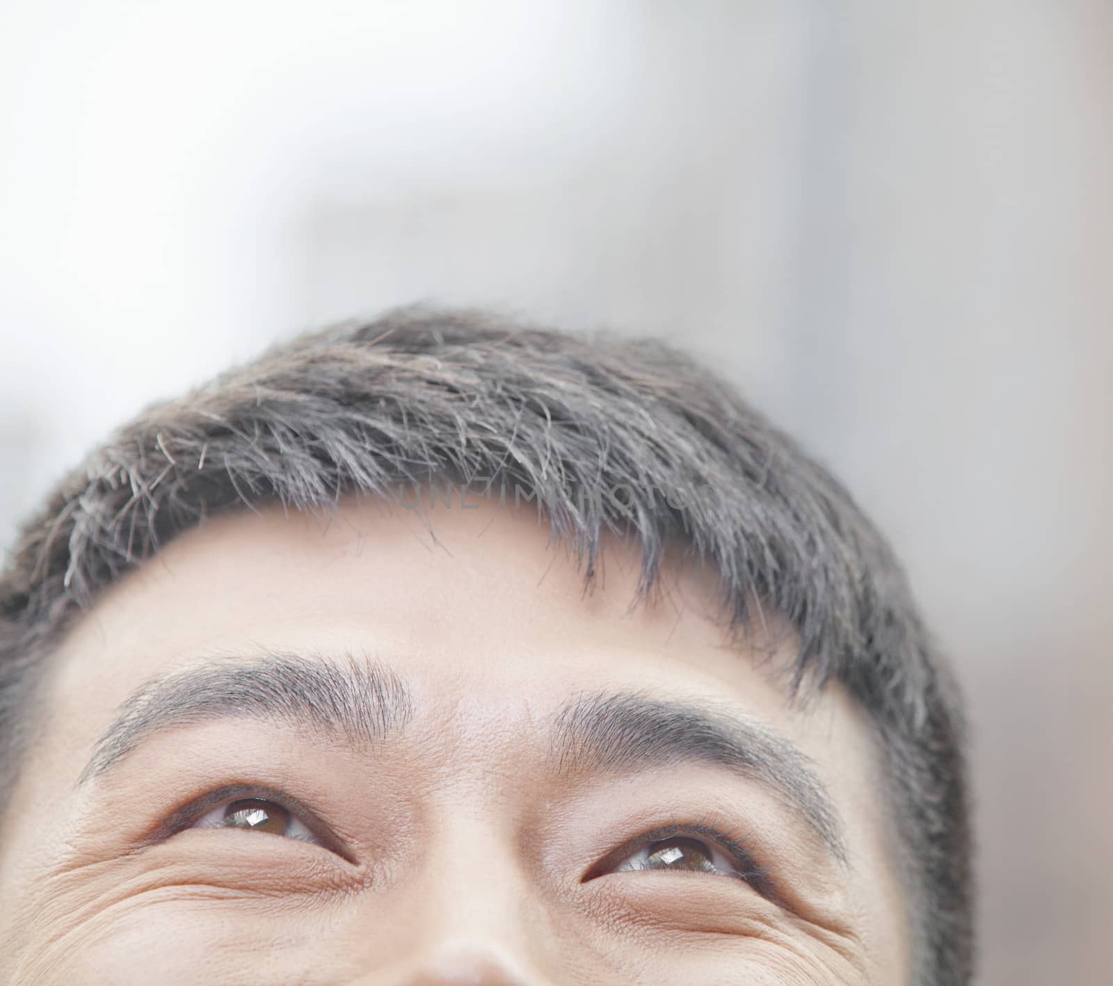 Close Up of Male Looking Up and Smiling in Beijing