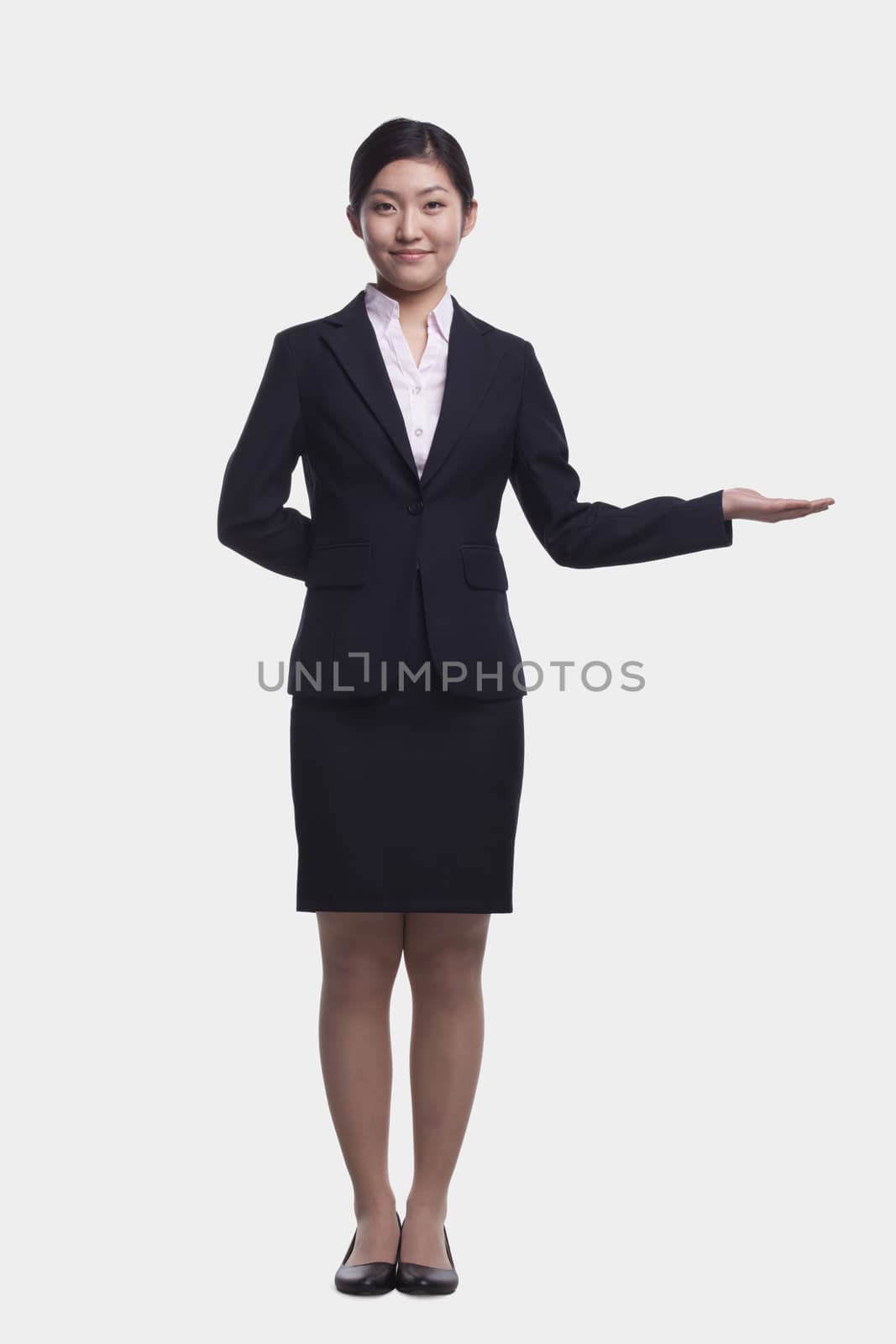 Young Businesswoman With Hand Out