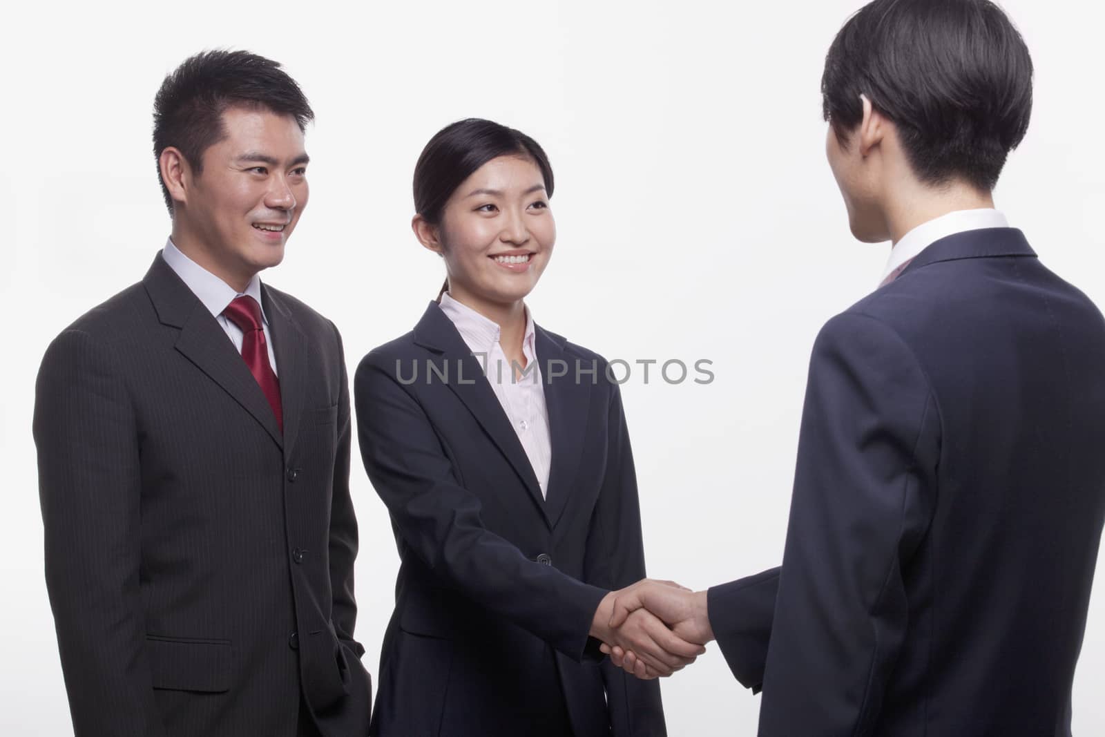 Businesspeople Meeting and Shaking Hands by XiXinXing