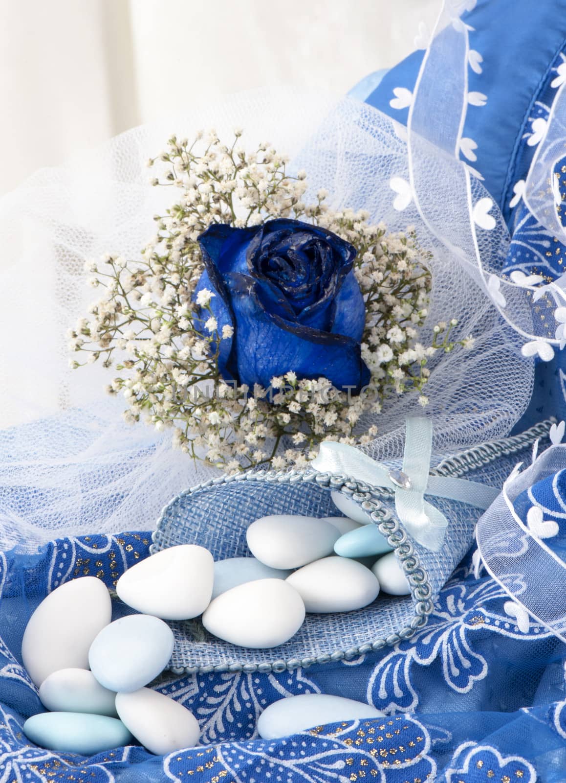 flowers candy and weddings favors on white background