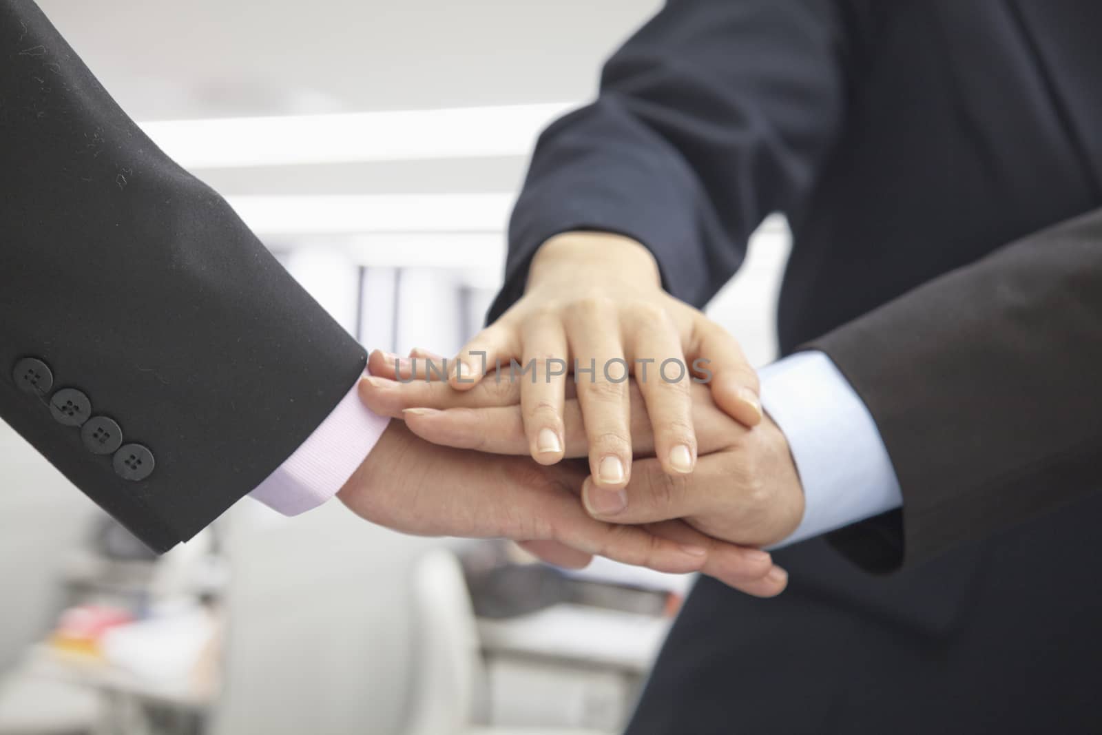 Pile of Three Business People Hands Together by XiXinXing