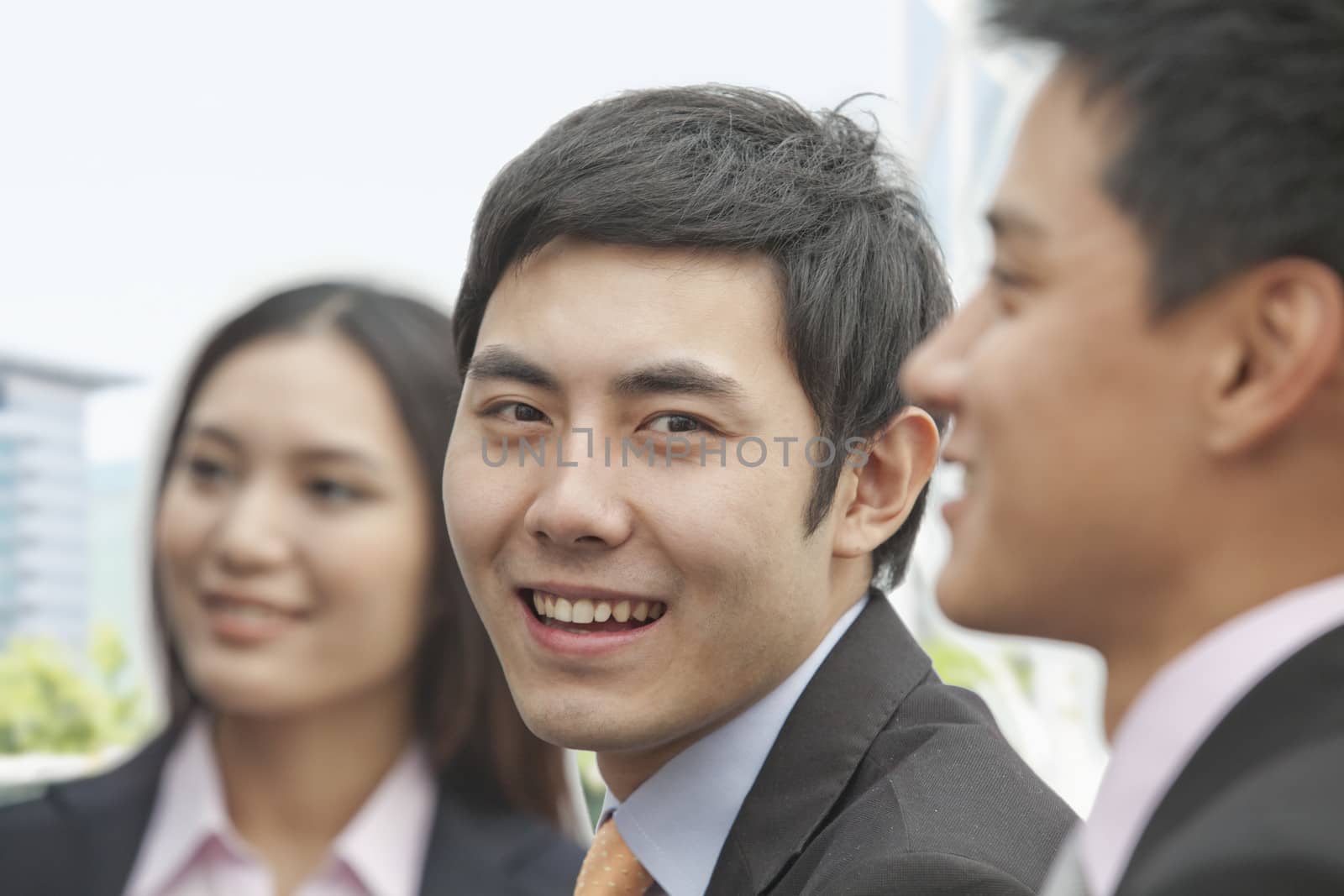 Businessman Looking at Camera by XiXinXing