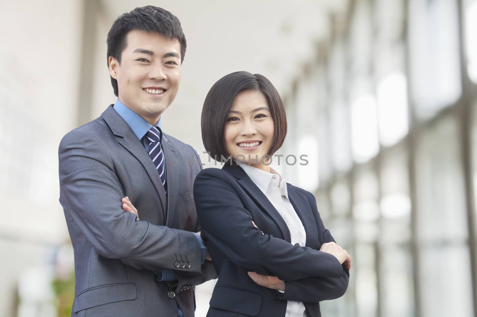 Two Business People with Arms Crossed