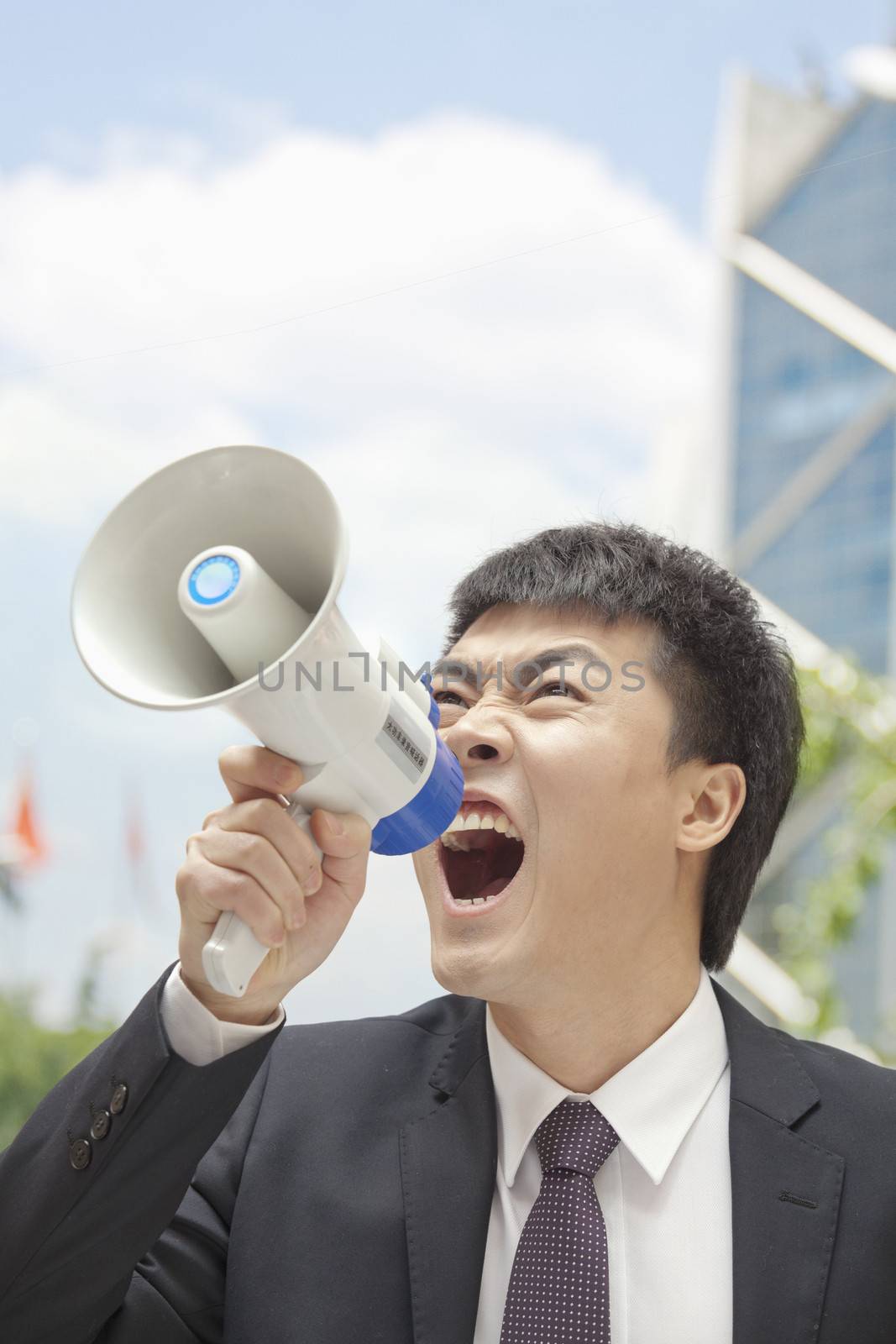 Mid Adult Businessman with Megaphone