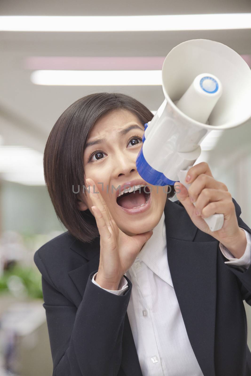 Young Businesswoman with Megaphone