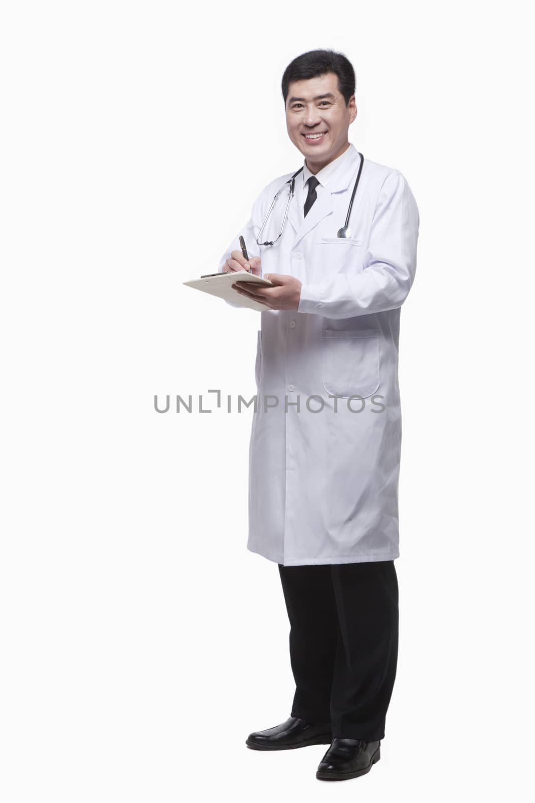 Full Length Portrait of Doctor Writing Medical Record