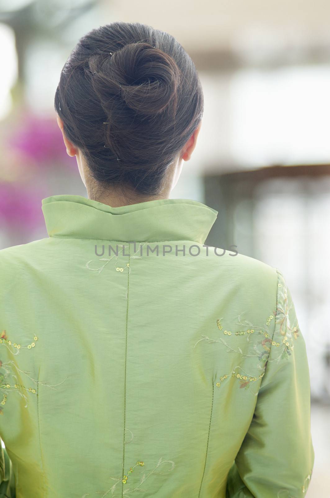 Restaurant/Hotel Hostess in Traditional Chinese Clothing, View From Behind
