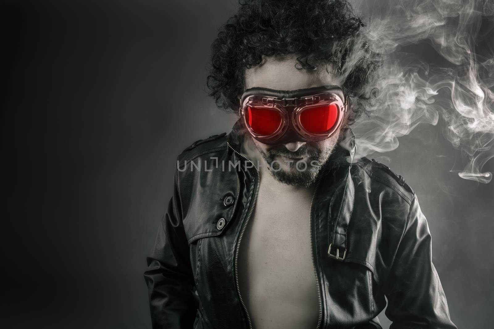 Man with leather jacket and smoke coming out of your body heat concept, sexy anger