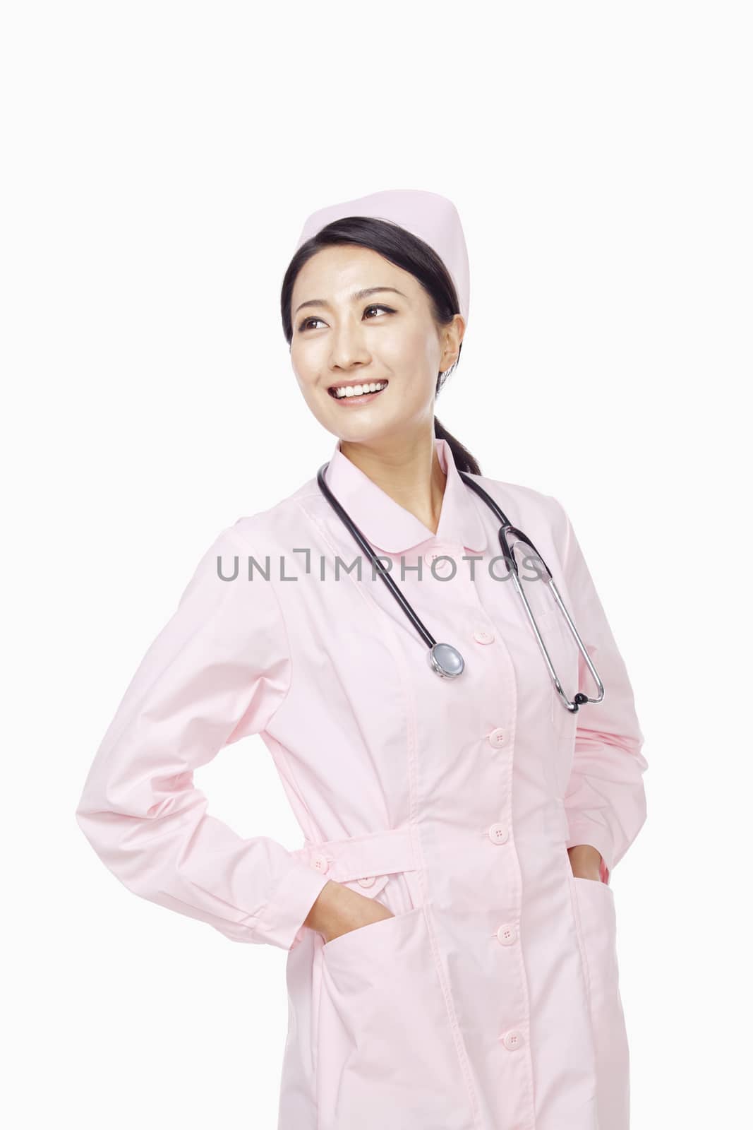 Portrait of young nurse, studio shot, China