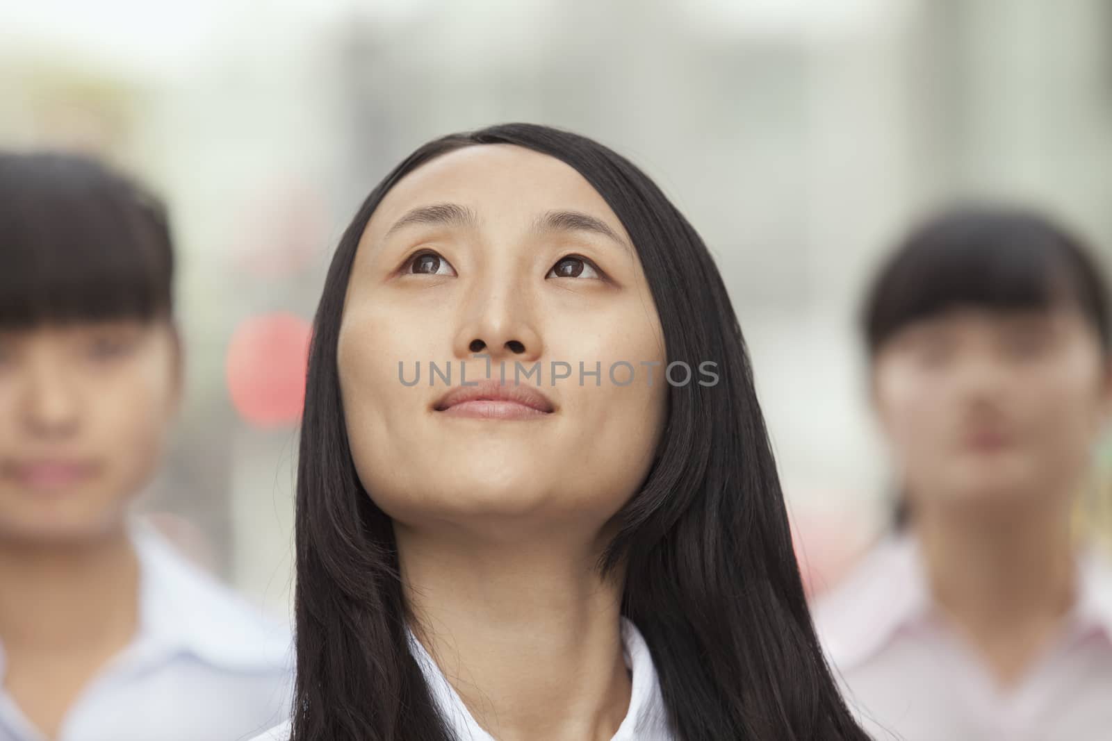 Young Businesswoman  Looking up by XiXinXing