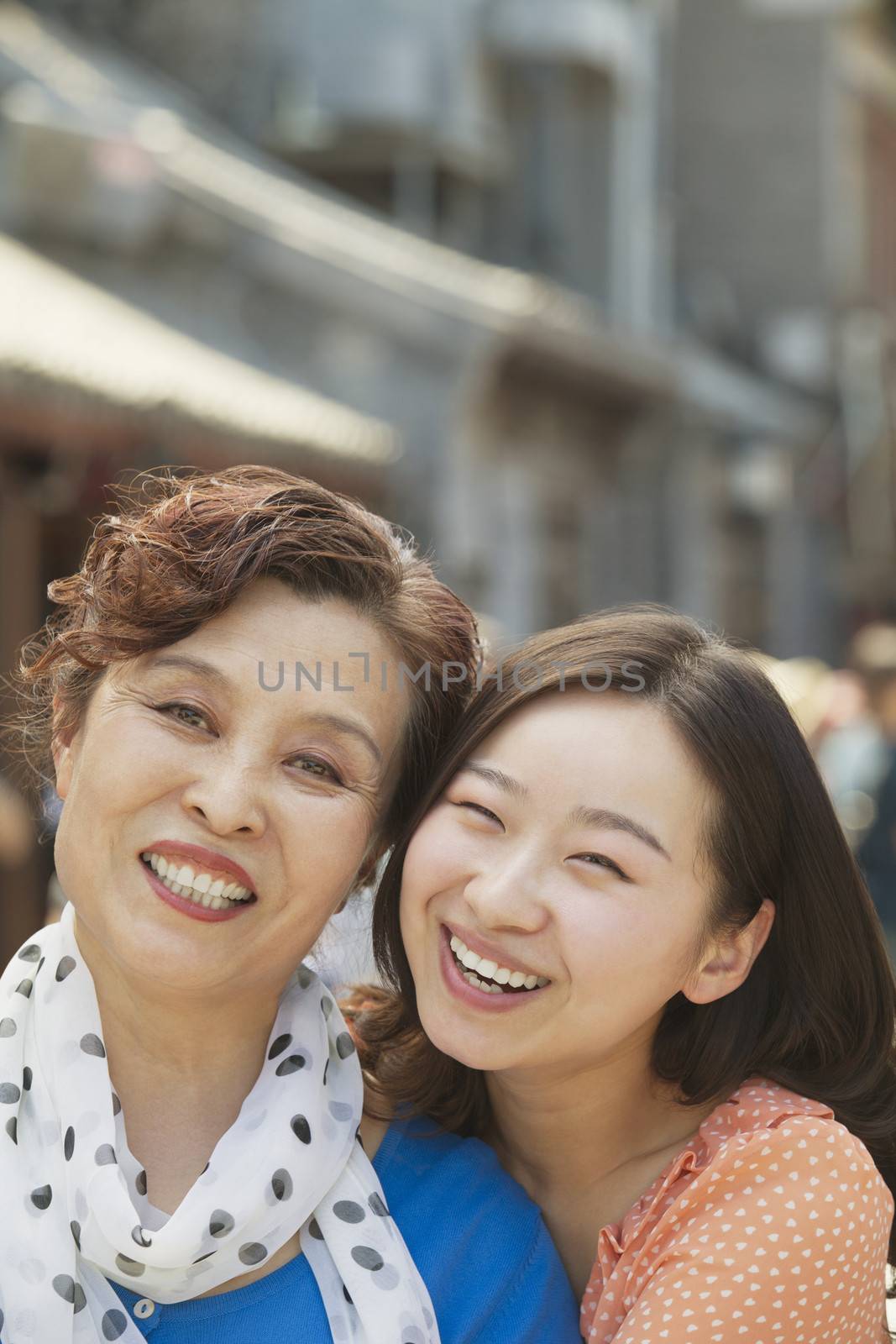Portrait of mother and daughter on the street in Beijing, close up
