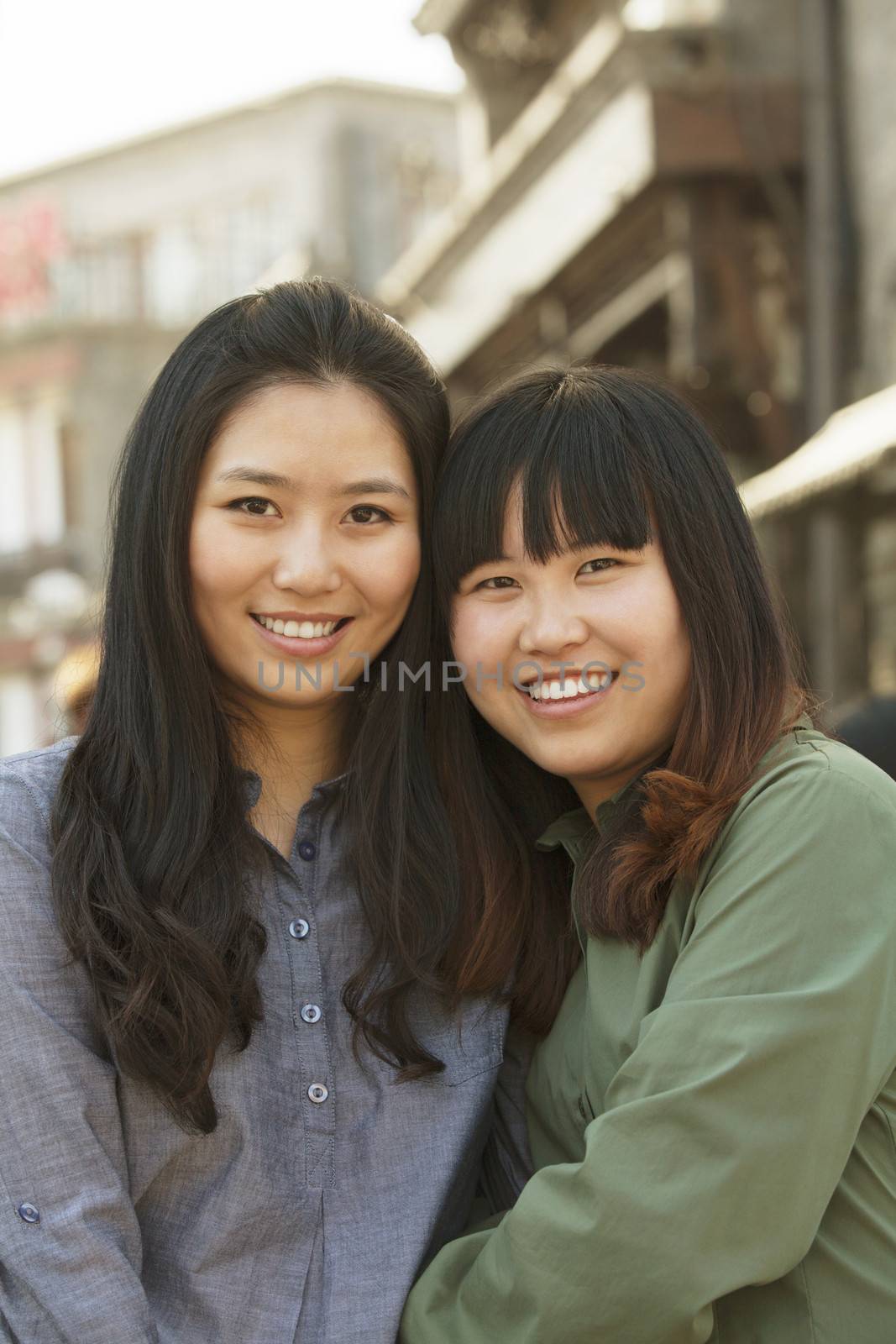 Portrait of two young friends in Beijing outdoors