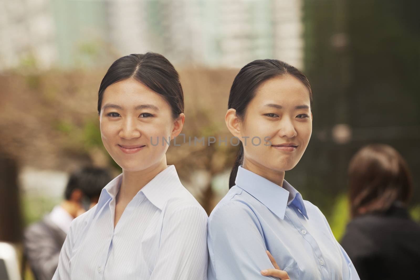 Portrait of two young businesswomen in Beijing