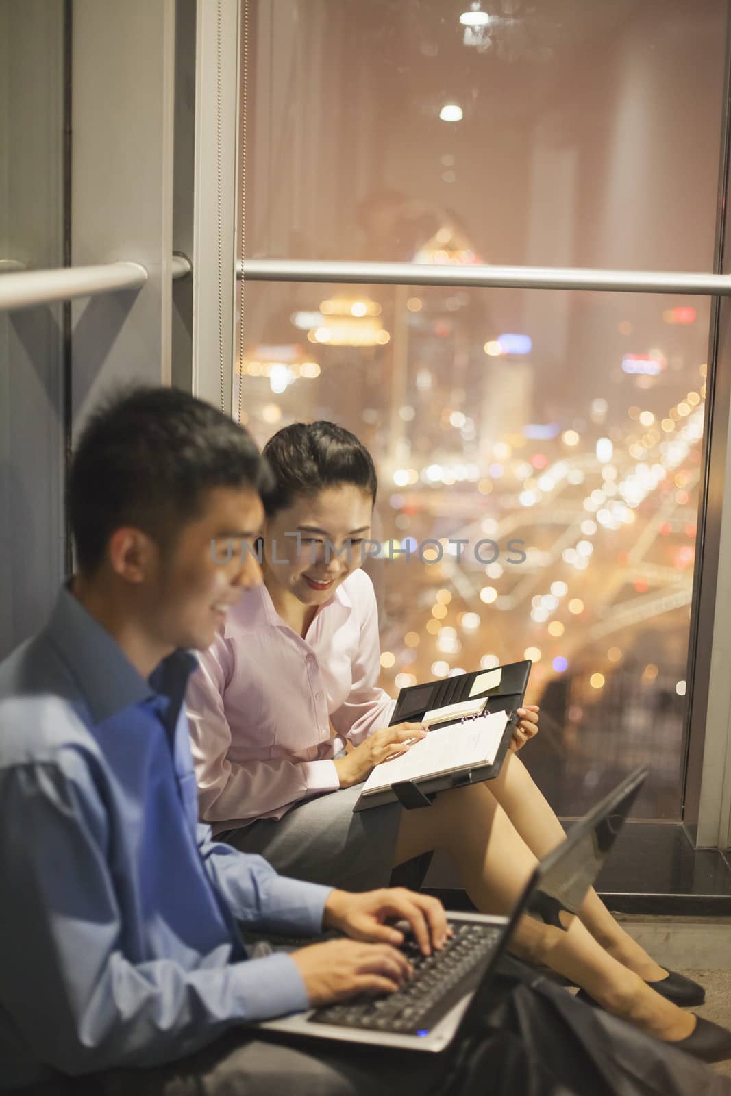 Two young people working in the office