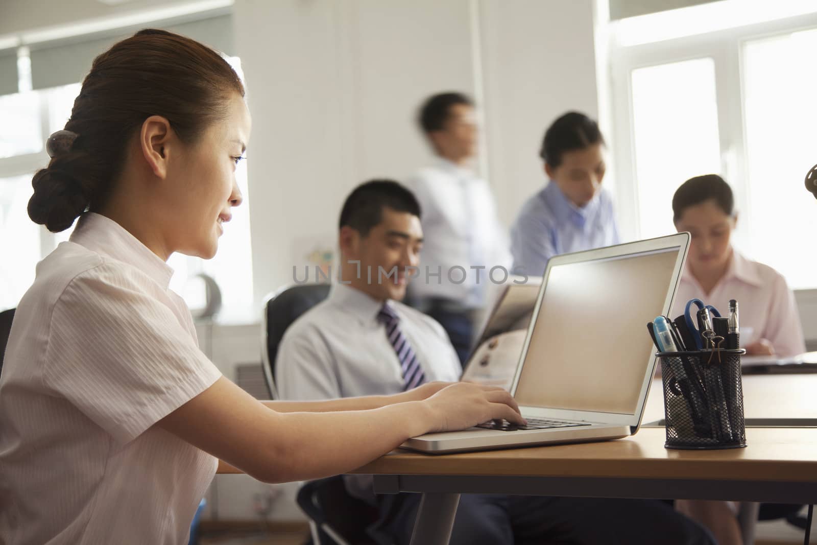 Woman working on her laptop in the office