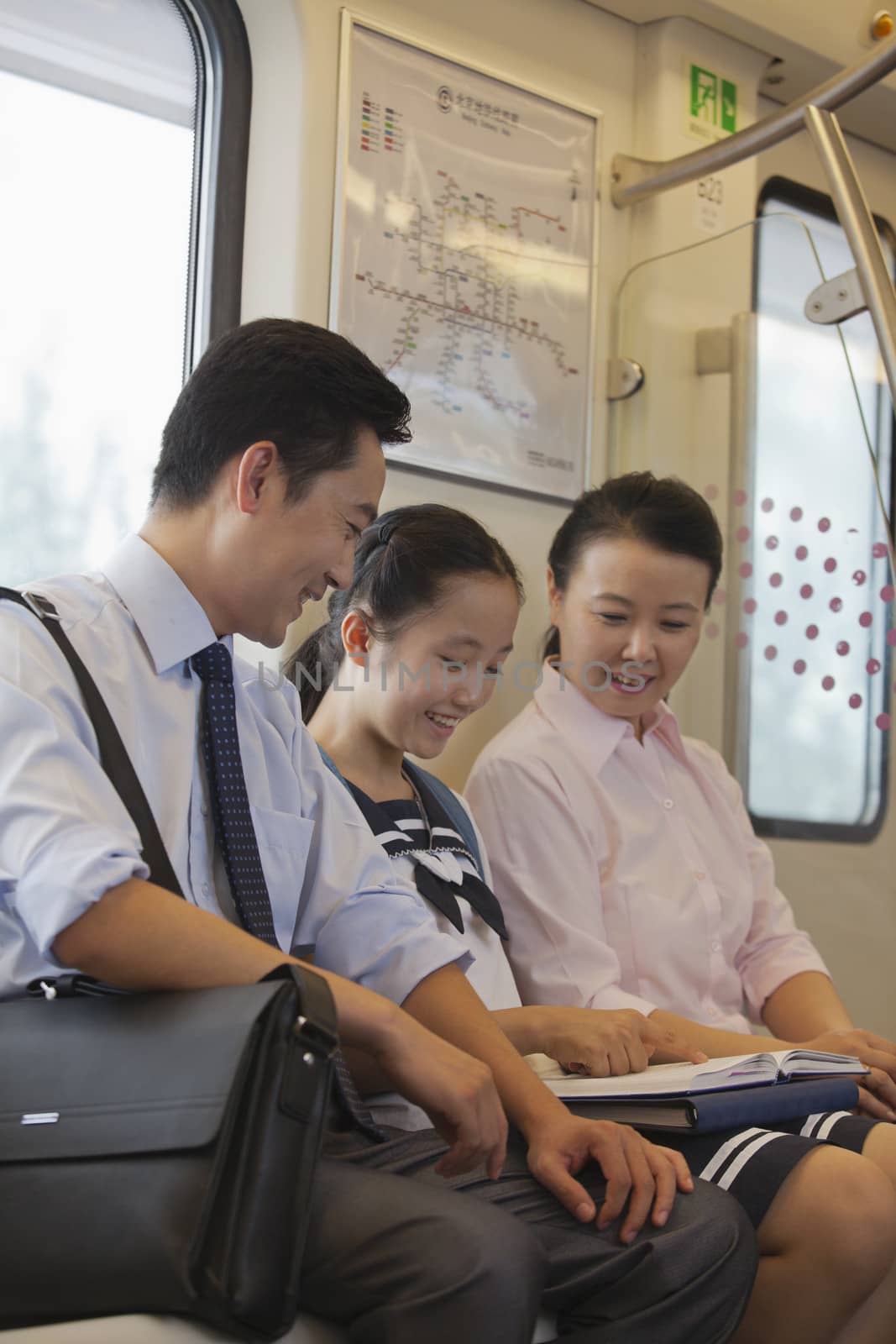 Family sitting in the subway