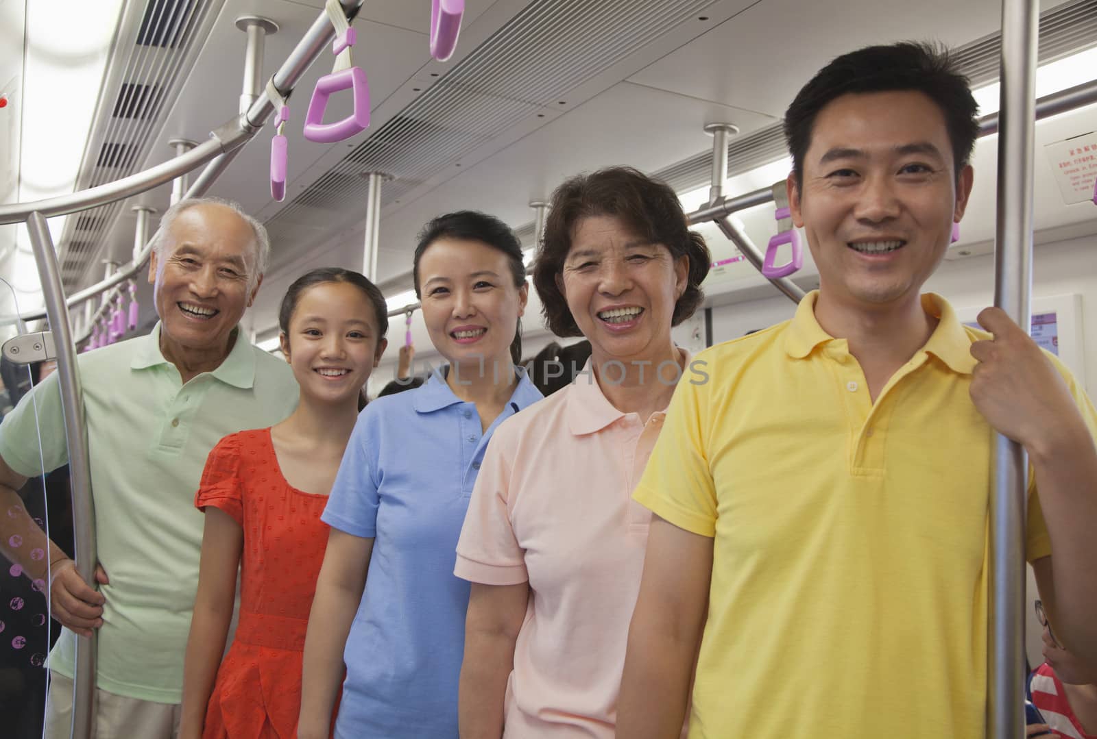 Family standing in the subway, portrait