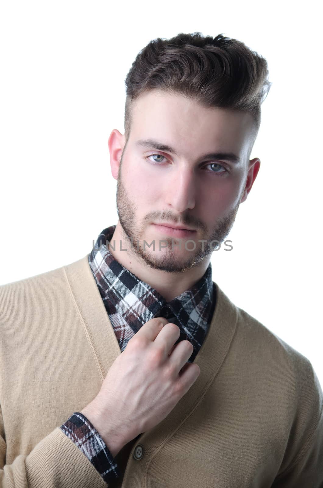 Handsome and stylish young man with checkered shirt and sweater, isolated on white