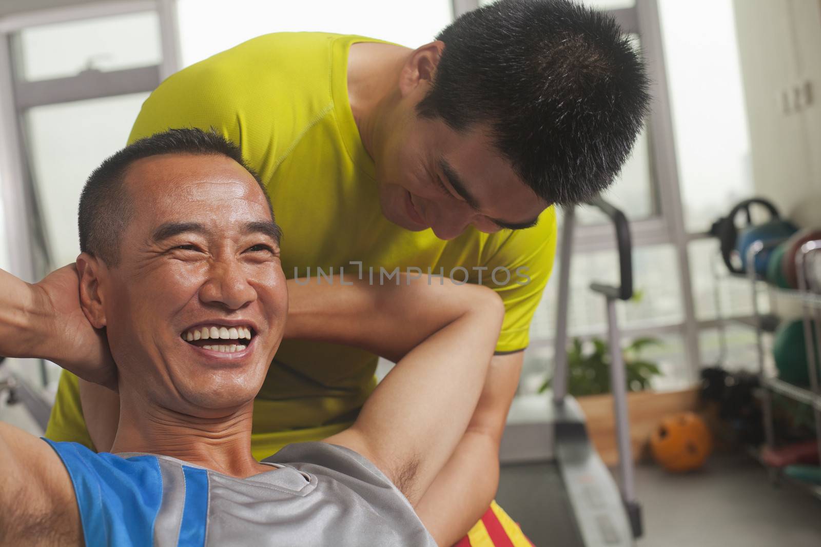 Man working out with his trainer