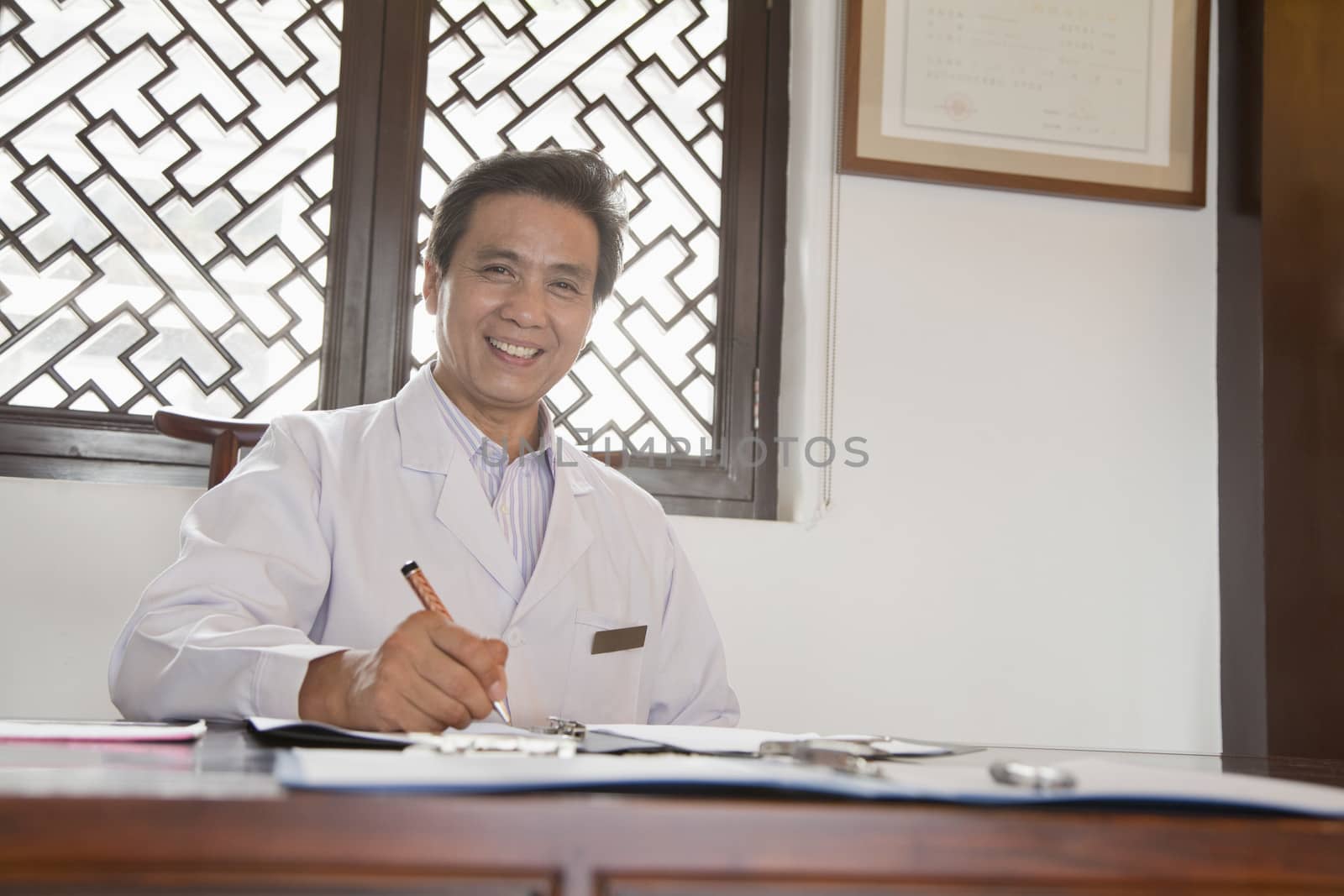 Doctor Writing at His Desk