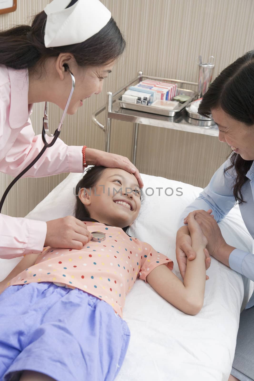 Doctor Listens to Little Girl's Heartbeat