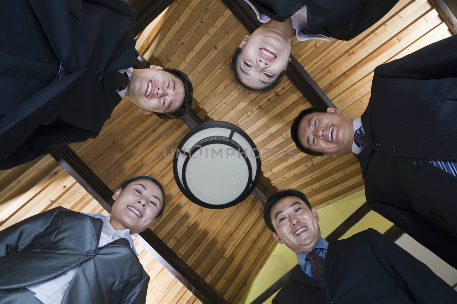 Low Angle Portrait of a Group of Businesspeople by XiXinXing