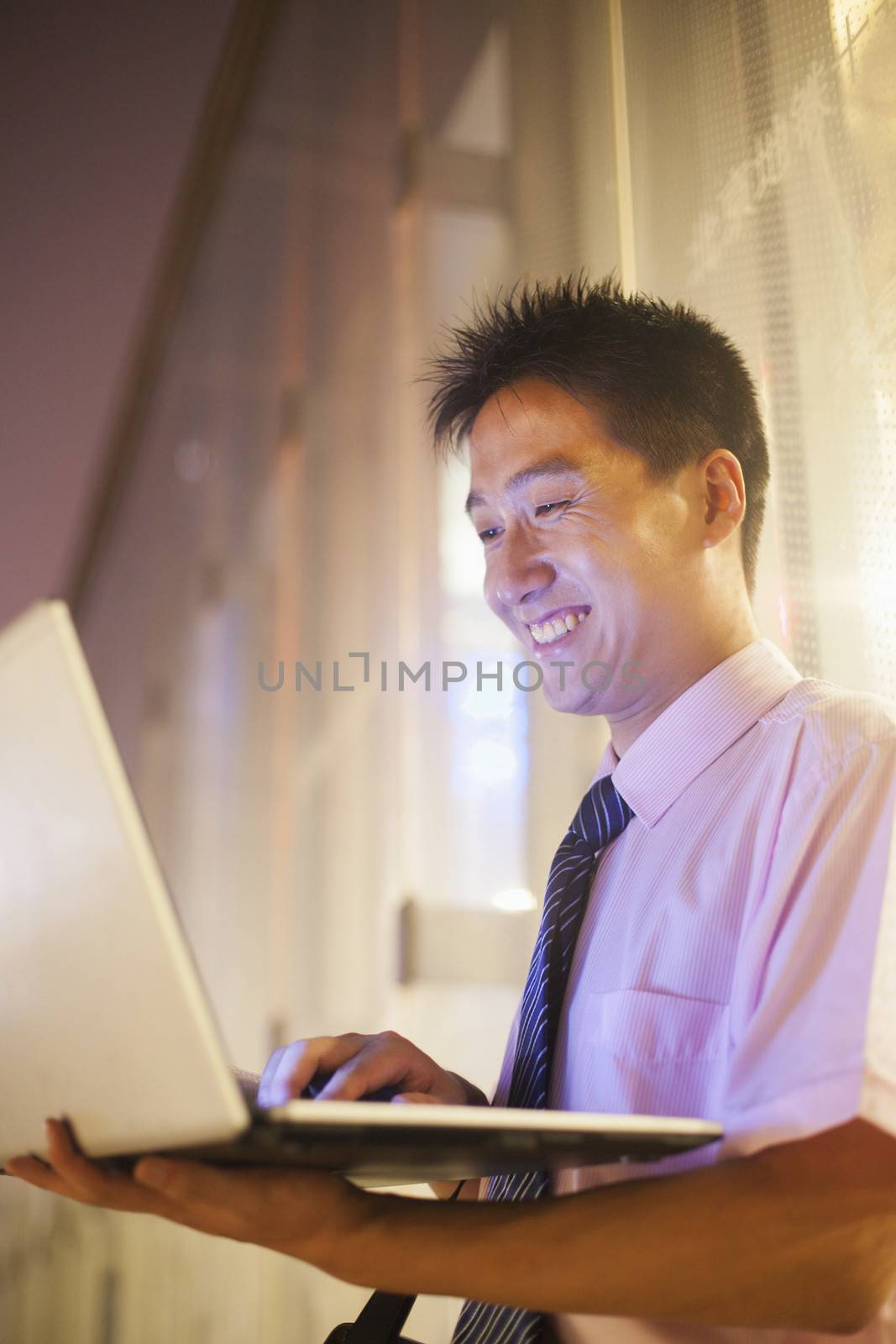 Young businessman with his laptop outdoor