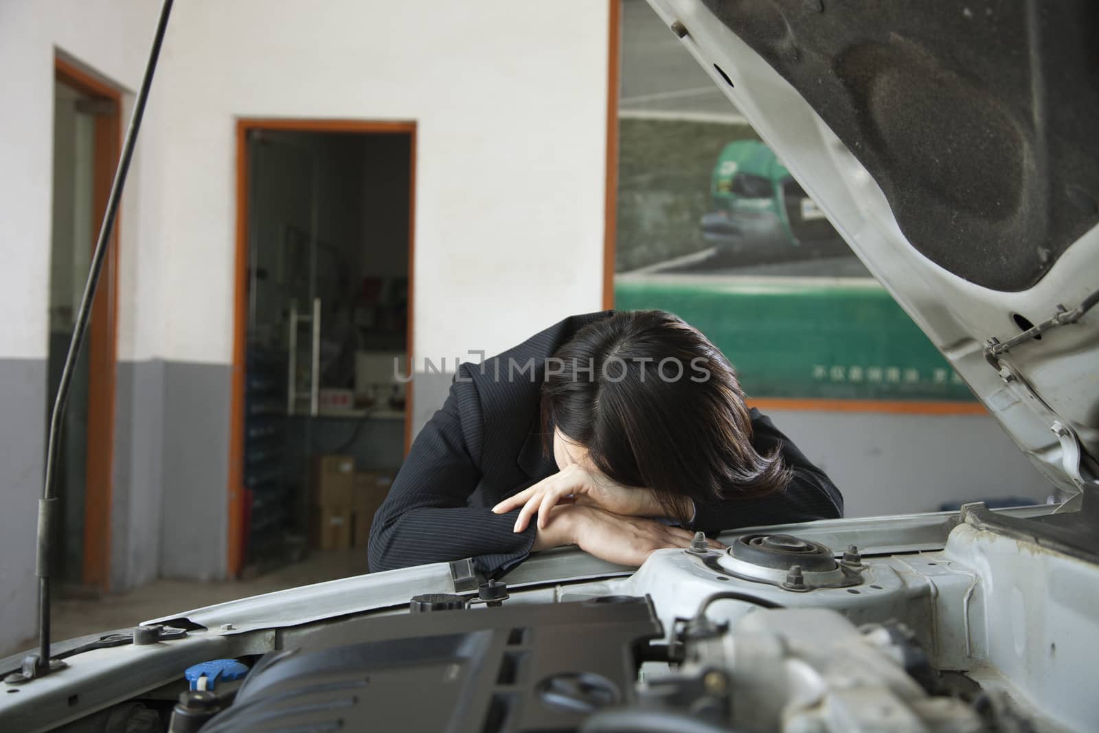 Businesswoman Frustrated with Car