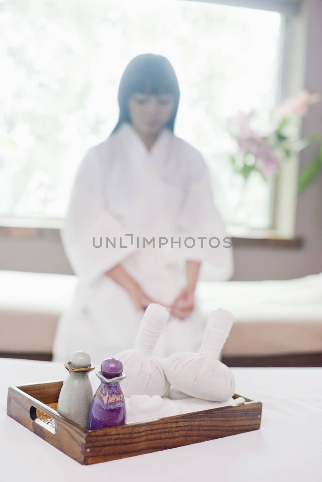 Woman at Spa with Herbs and Oils