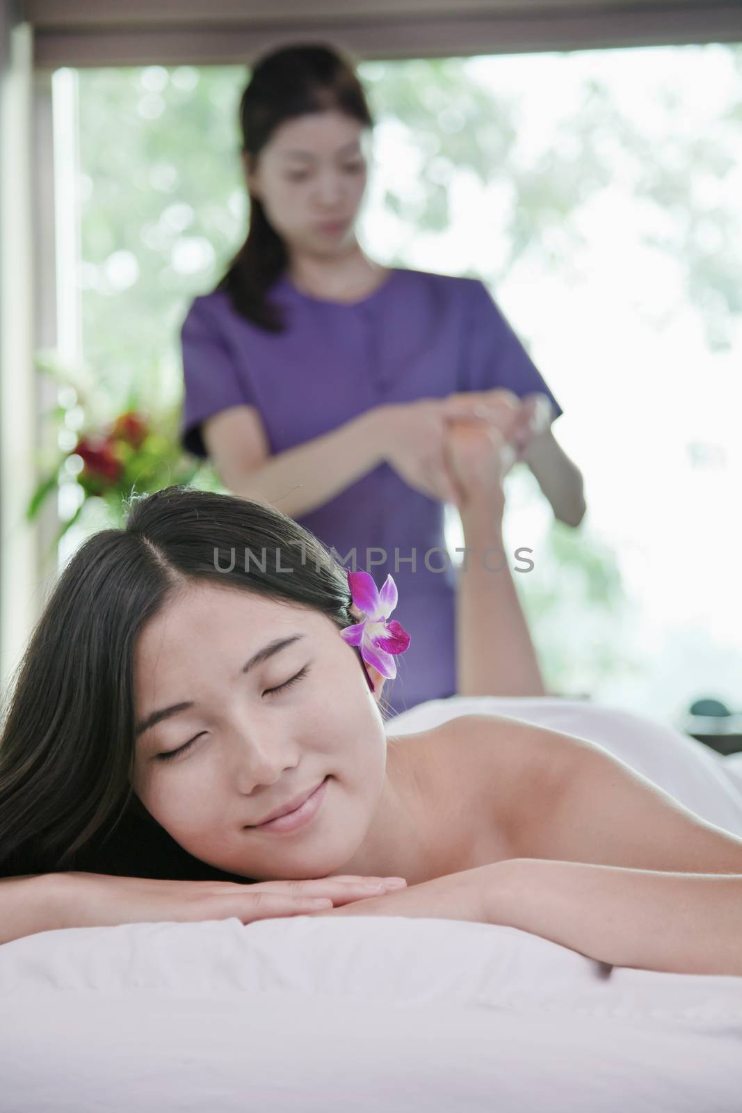 Woman Receiving Foot Massage by XiXinXing