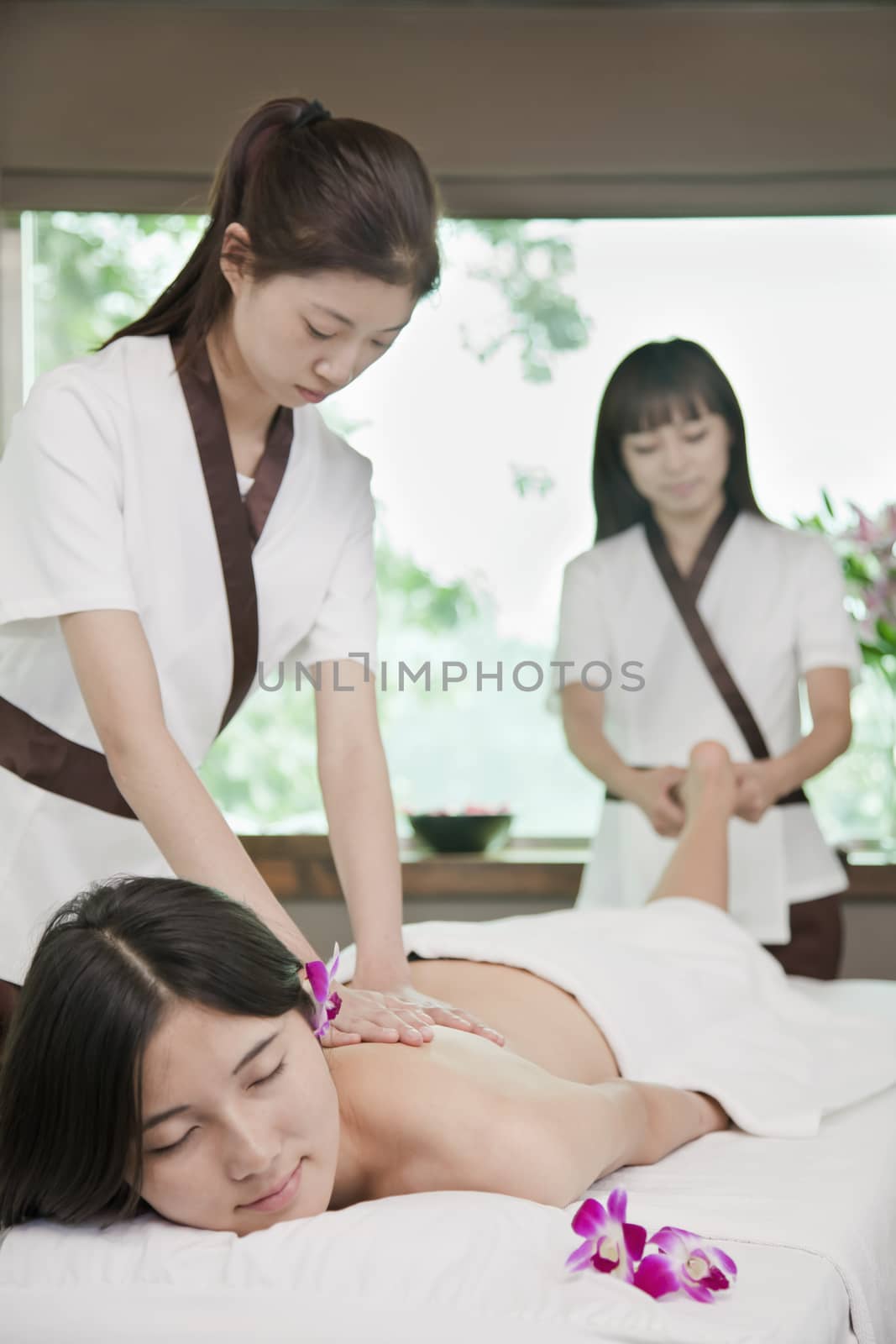 Two Masseuses Massaging One Woman by XiXinXing